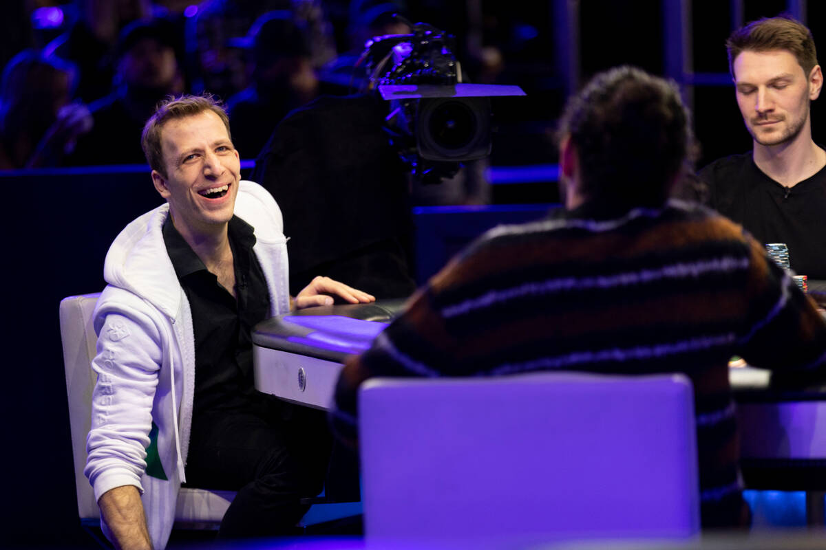 Benny Glaser, left, with Eliot Hudon, reacts whiles competing in the final table of the World P ...