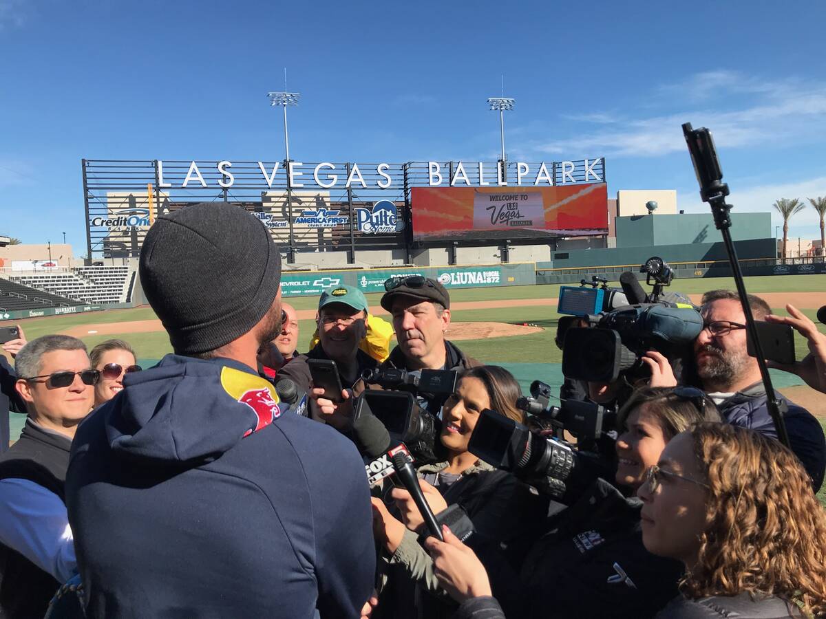 RJ sports writer Ron Kantowski, center in cap, is shown in a media scrum at Las Vegas Ballpark ...