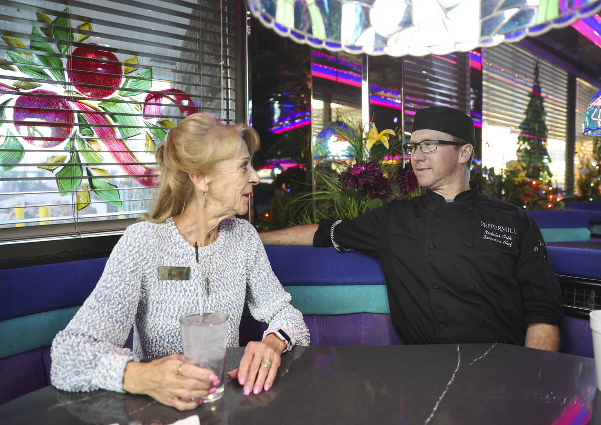 Peggy Orth, general manager of the Peppermill, talks with her son, Nicholas Orth, who is the ex ...