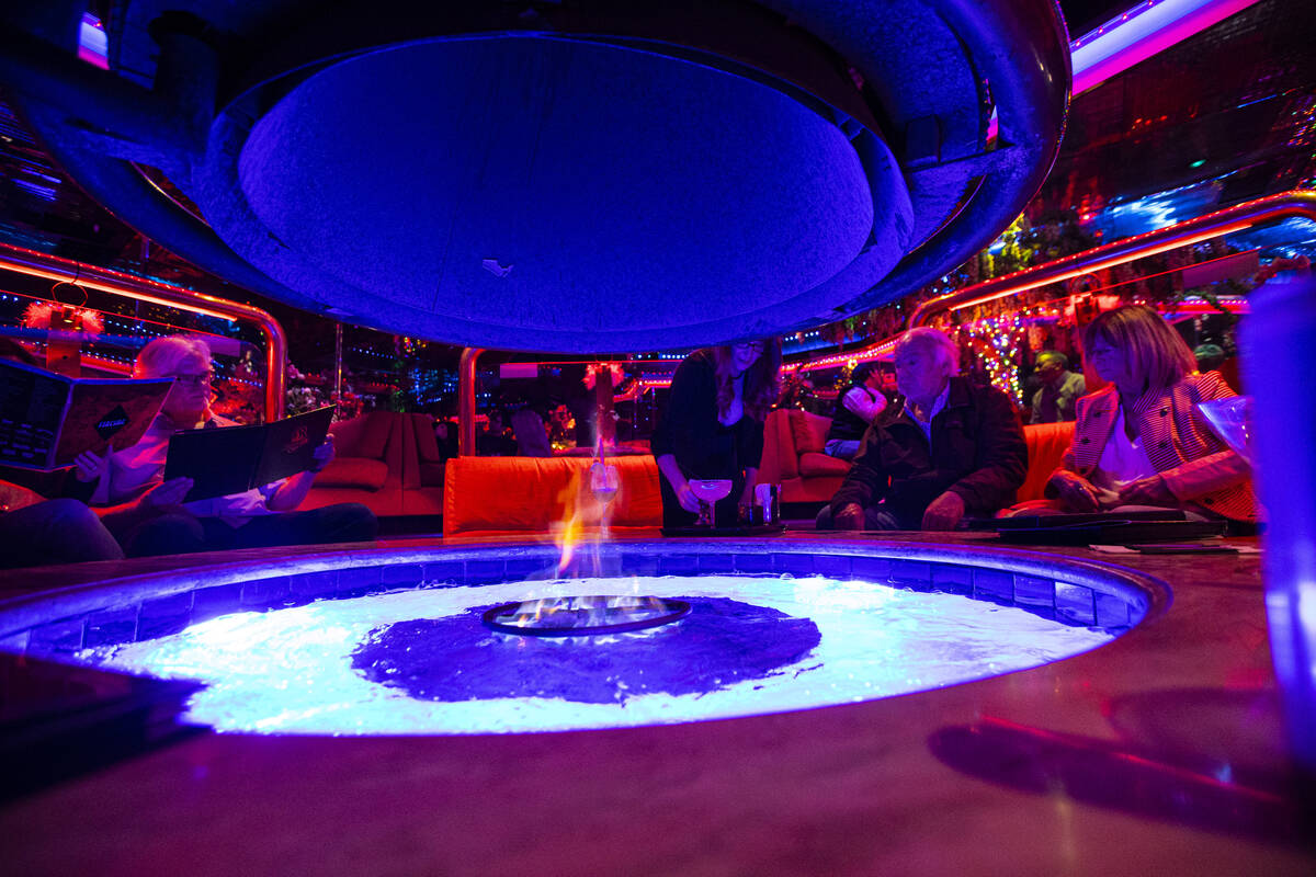 Patrons relax in the Fireside Lounge at Peppermill on Tuesday, Dec. 13, 2022, in Las Vegas. The ...