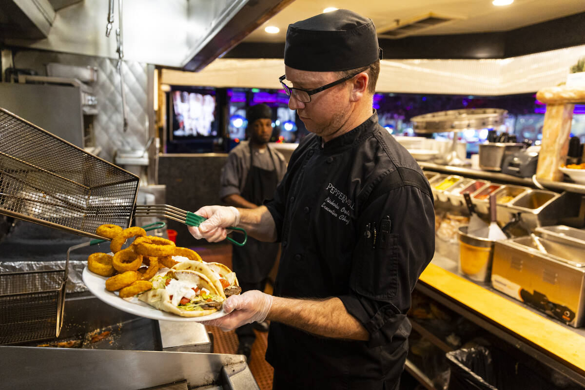 Executive Chef Nicholas Orth prepares gyros and onion rings at Peppermill on Wednesday, Dec. 14 ...