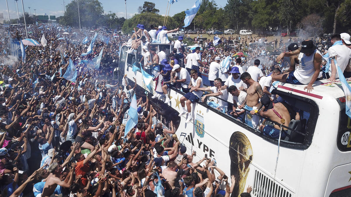 Soccer fans welcome home the Argentine soccer team after it won the World Cup tournament in Bue ...