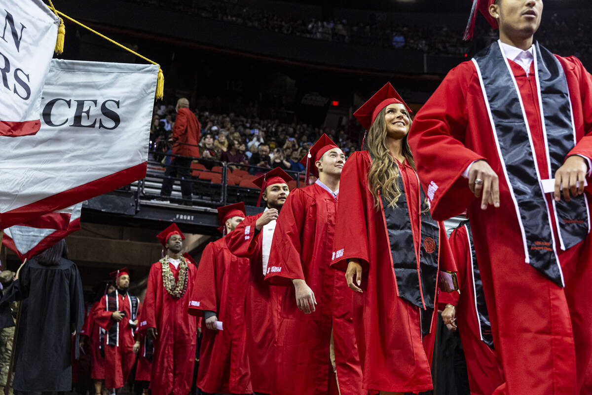 Students proceed to their seats during a UNLV commencement ceremony at the Thomas & Mack Ce ...