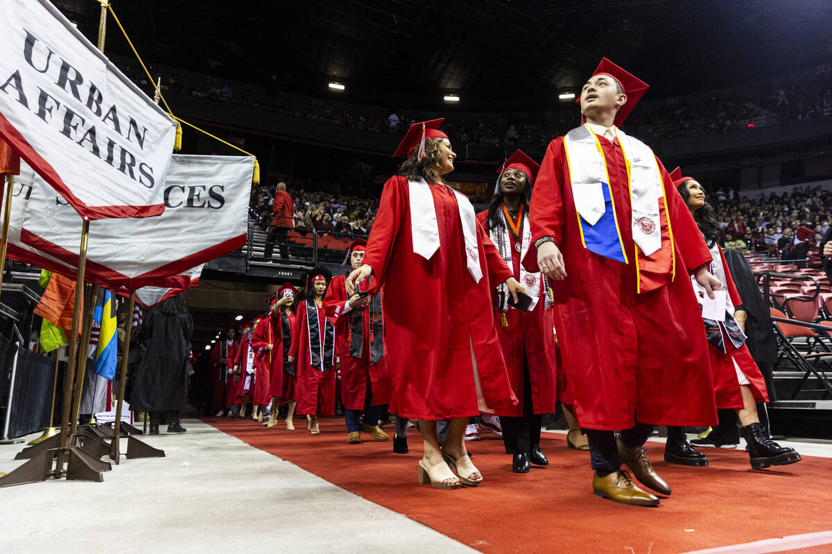Students proceed to their seats during a UNLV commencement ceremony at the Thomas & Mack Ce ...