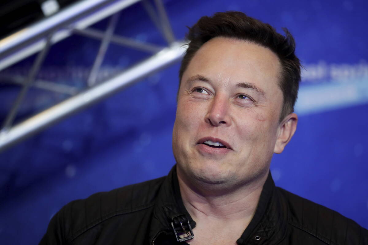 FILE - Tesla and SpaceX CEO Elon Musk arrives on the red carpet for the Axel Springer media awa ...