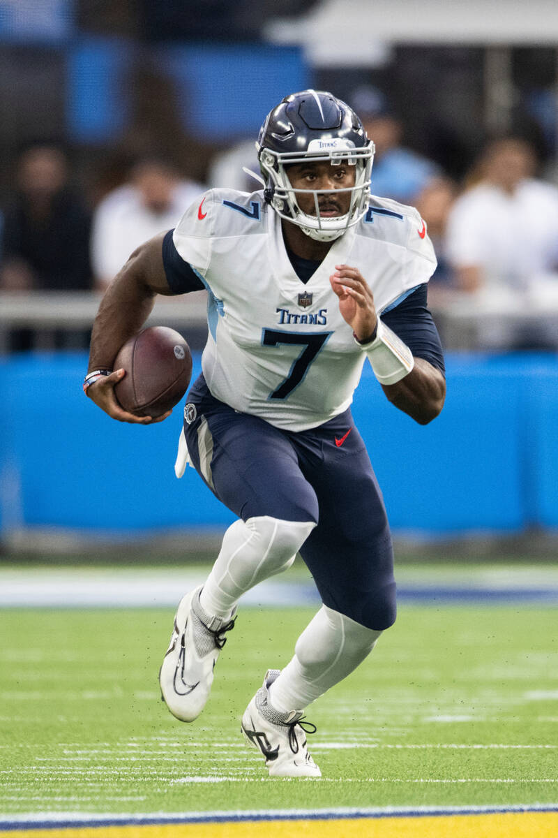 Tennessee Titans quarterback Malik Willis (7) runs with the ball during an NFL football game ag ...