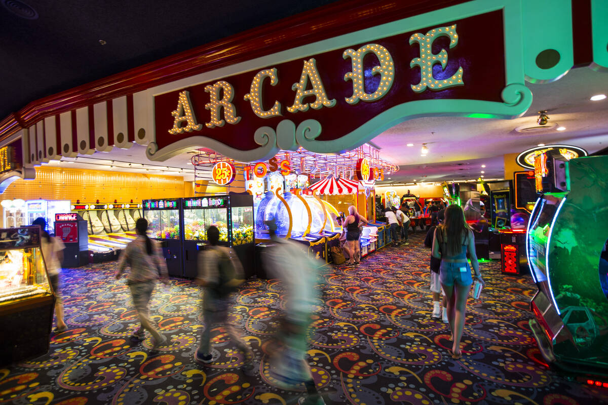 People pass by a variety of arcade games at the carnival midway at Circus Circus in Las Vegas o ...