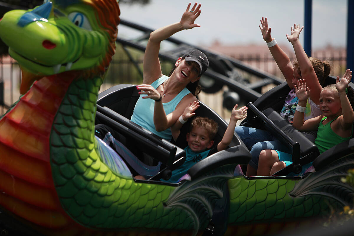 Desiree Cope rides in the front row of the Dragon Coast with son Jaxon Cope, 4, at Las Vegas Mi ...