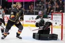 Vegas Golden Knights right wing Mark Stone (61) goes for a loose puck as Arizona Coyotes goalte ...