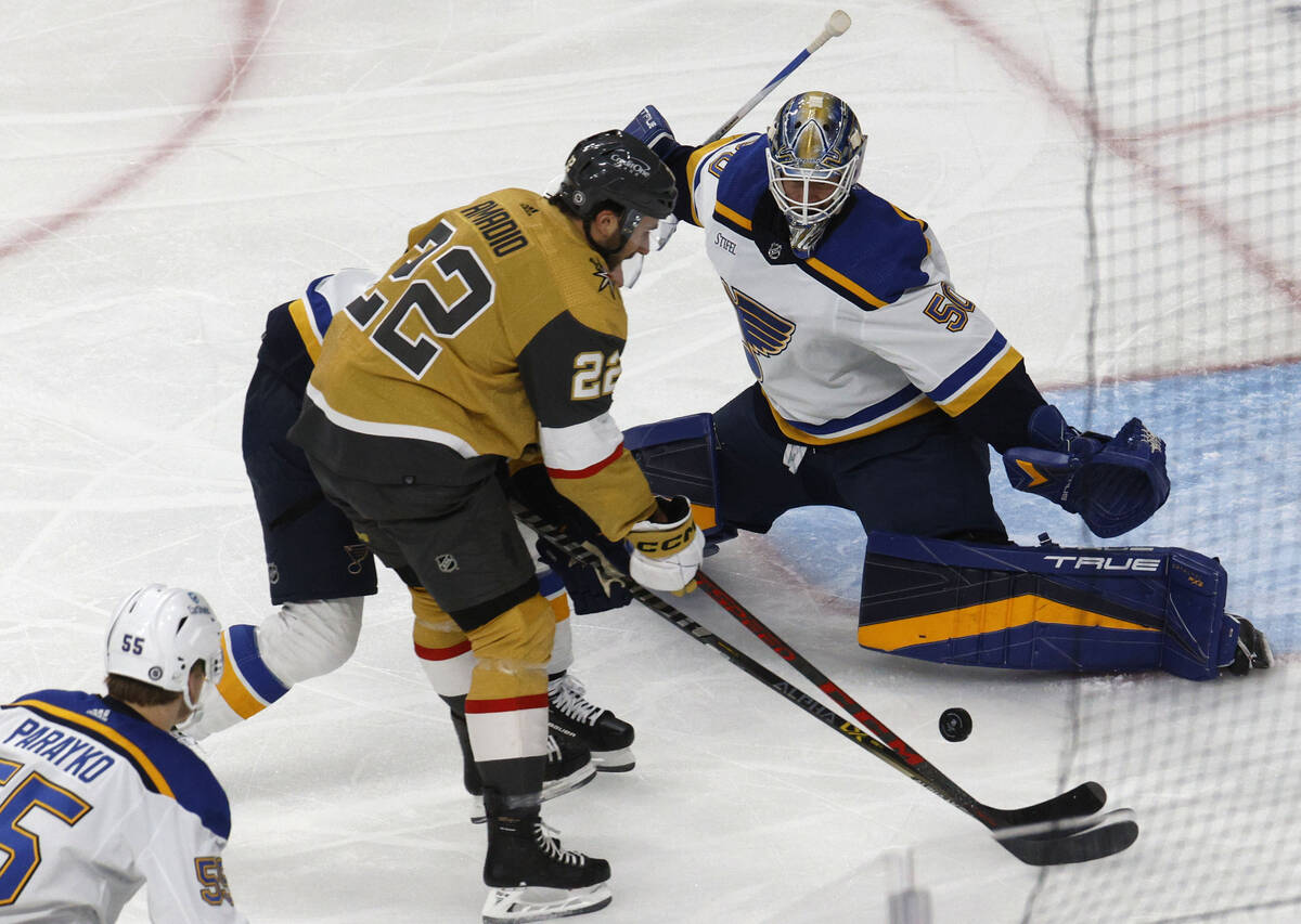 Golden Knights center Michael Amadio (22) tries to shoot against St. Louis Blues goaltender Jor ...