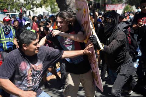 FILE- In this Aug. 27, 2017, file photo, demonstrators clash during a free speech rally in Berk ...