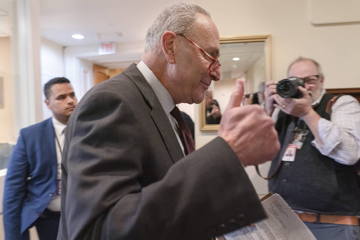 Senate Majority Leader Chuck Schumer of N.Y., makes the thumbs up sign as he arrives for a news ...