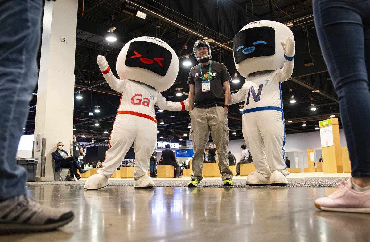 Michael Strickland, of Alpharetta, Ga., poses for a picture with characters representing GaNFas ...