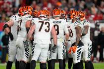 Cincinnati Bengals quarterback Joe Burrow (9) in the huddle with offensive linemen during the s ...