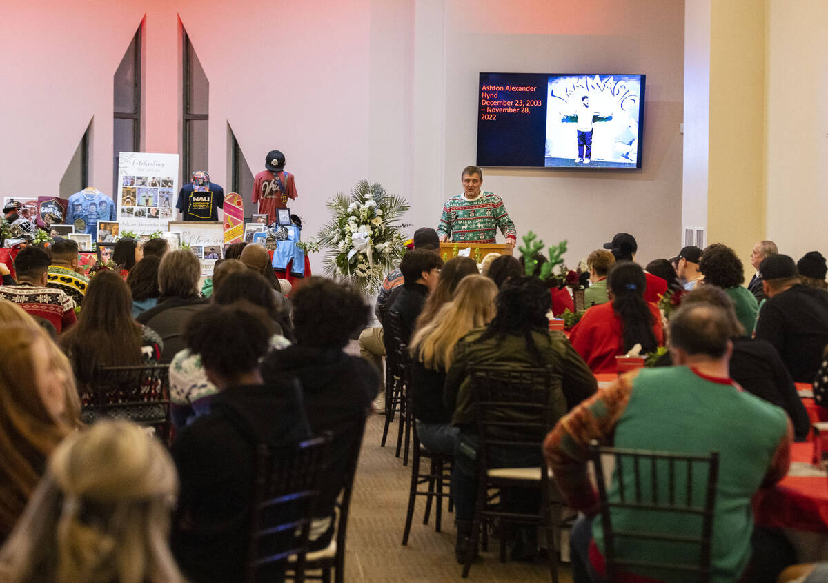 David Albert, a family friend, speaks during a memorial service at Palm Northwest Mortuary to h ...