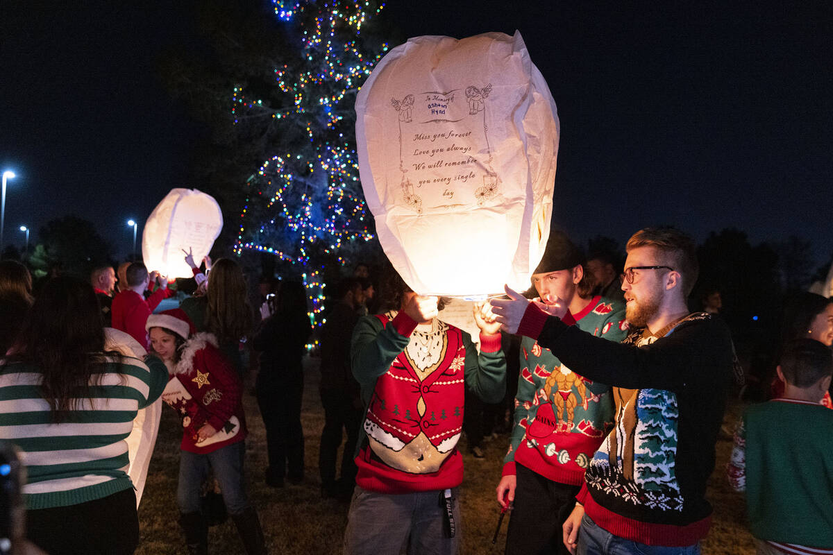 Family members and friends gathered to release sky lanterns after a memorial service at Palm No ...