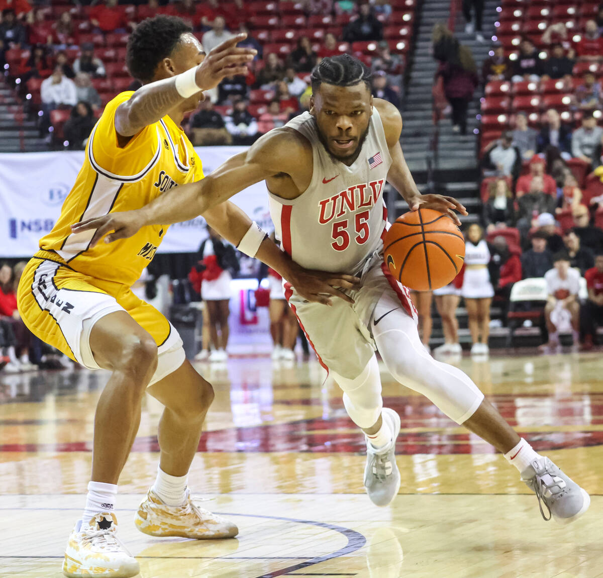 UNLV Rebels guard EJ Harkless (55) drives to the basket against Southern Miss Golden Eagles gua ...