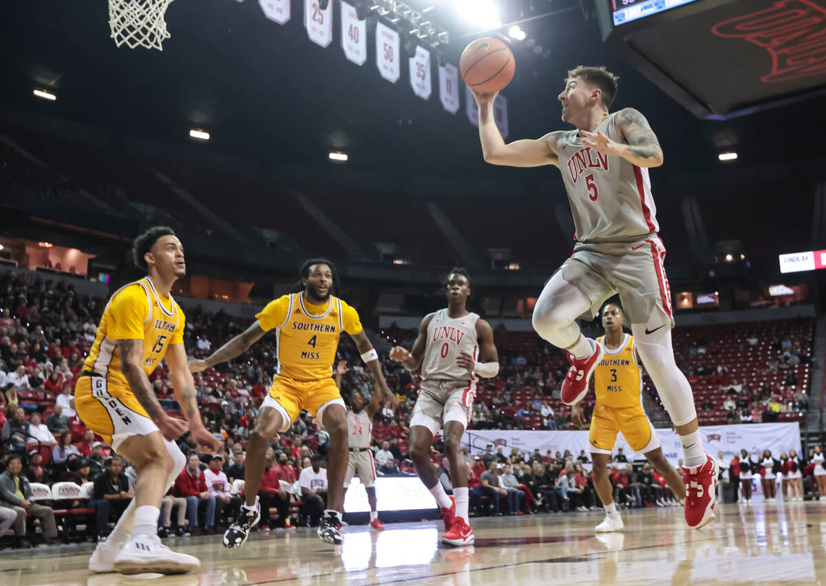 UNLV Rebels guard Jordan McCabe (5) lays up the ball against the Southern Miss Golden Eagles du ...