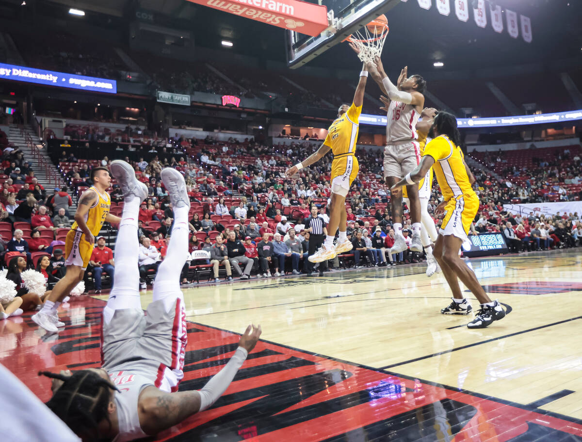 UNLV Rebels guard Luis Rodriguez (15) sinks the ball in against the Southern Miss Golden Eagles ...