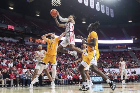 UNLV Rebels guard Luis Rodriguez (15) lays up the ball against the Southern Miss Golden Eagles ...