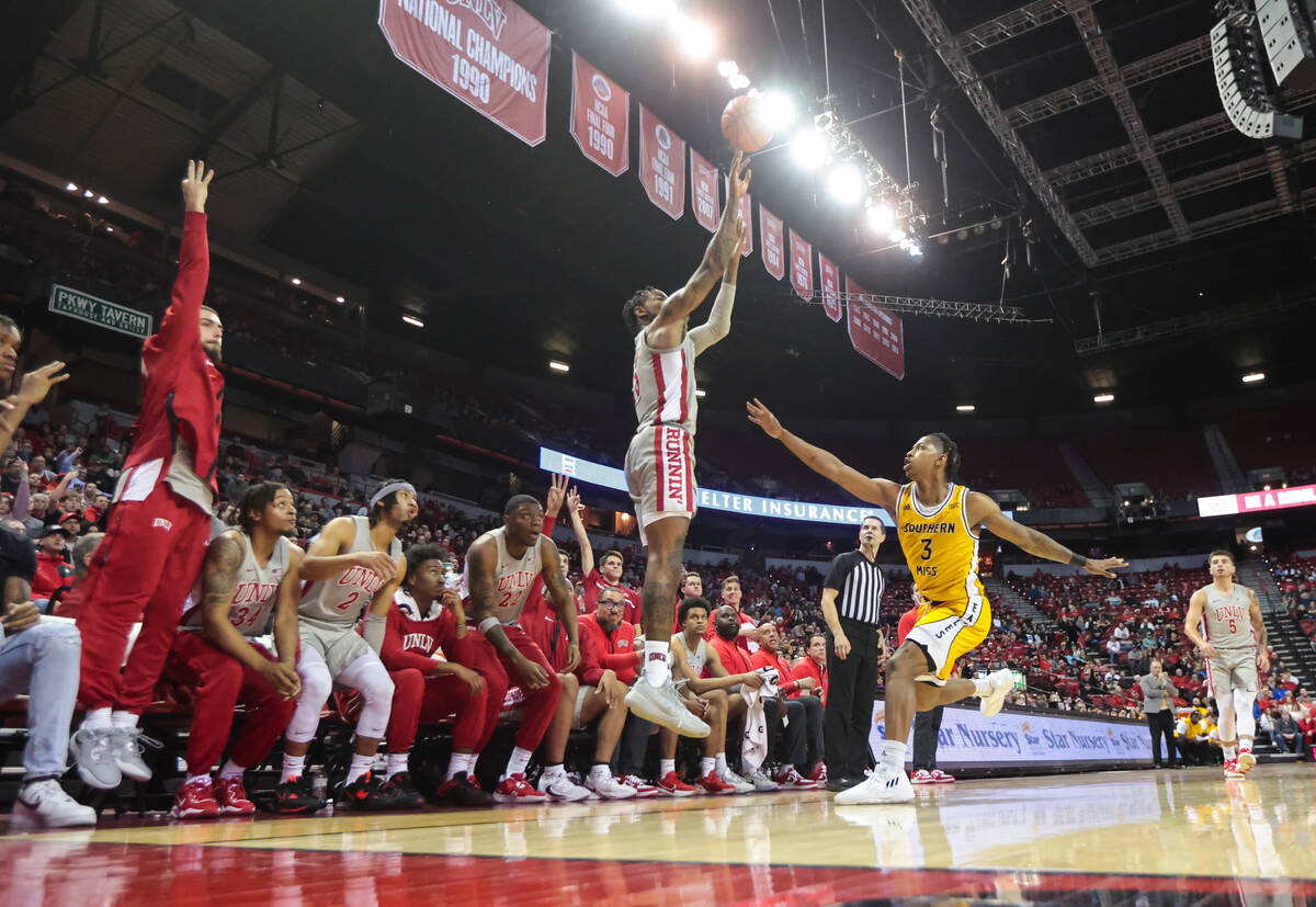 UNLV Rebels guard Luis Rodriguez (15) shoots a three-point basket as Southern Miss Golden Eagle ...