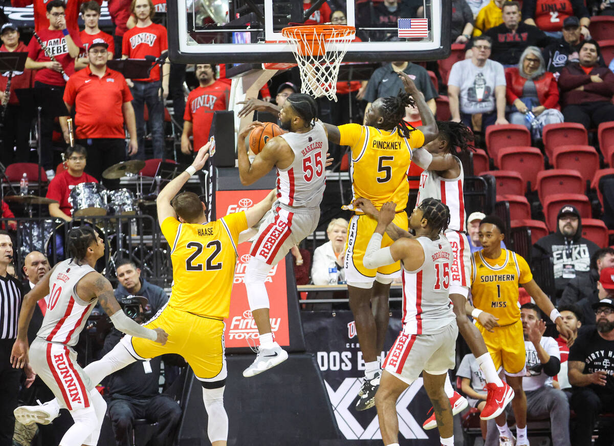 UNLV Rebels guard EJ Harkless (55) grabs the rebound against Southern Miss Golden Eagles forwar ...