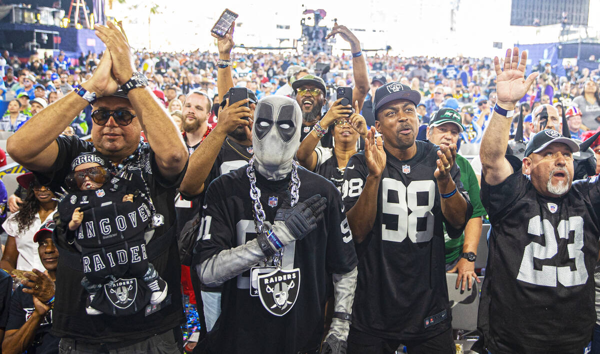 Raiders fans celebrate after Las Vegas made a draft pick during day three of the NFL draft on S ...