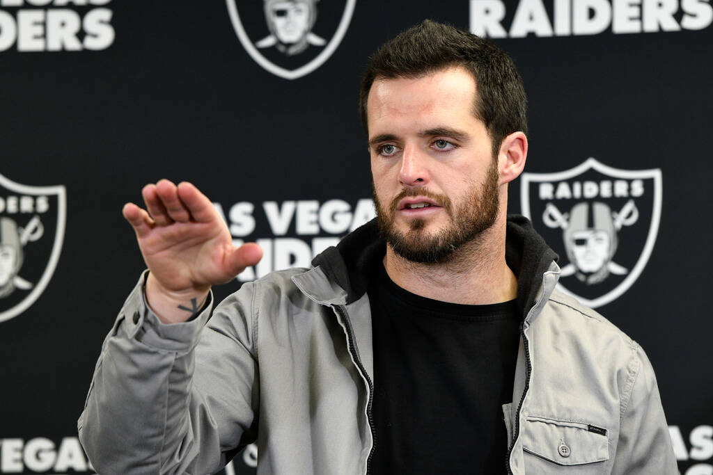 Las Vegas Raiders quarterback Derek Carr meets with reporters after an NFL football game agains ...