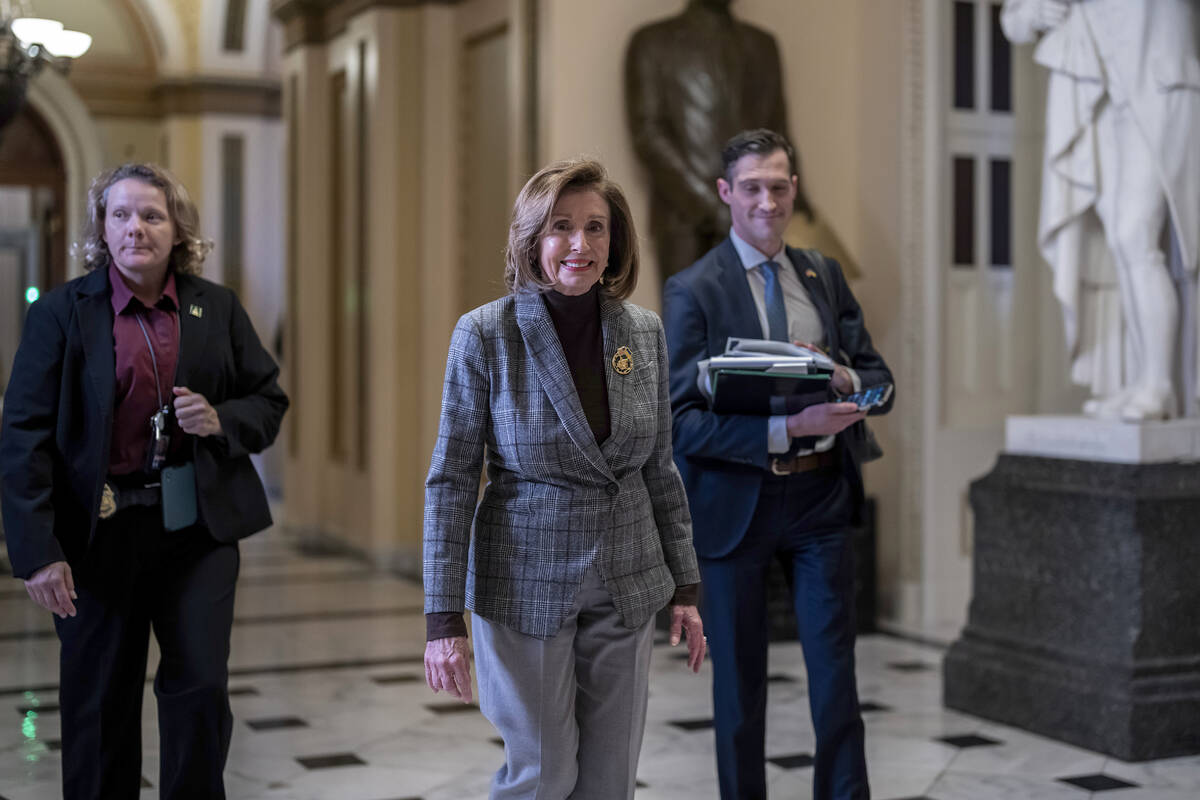 Speaker of the House Nancy Pelosi, D-Calif., leaves the chamber as the final votes of the 117th ...
