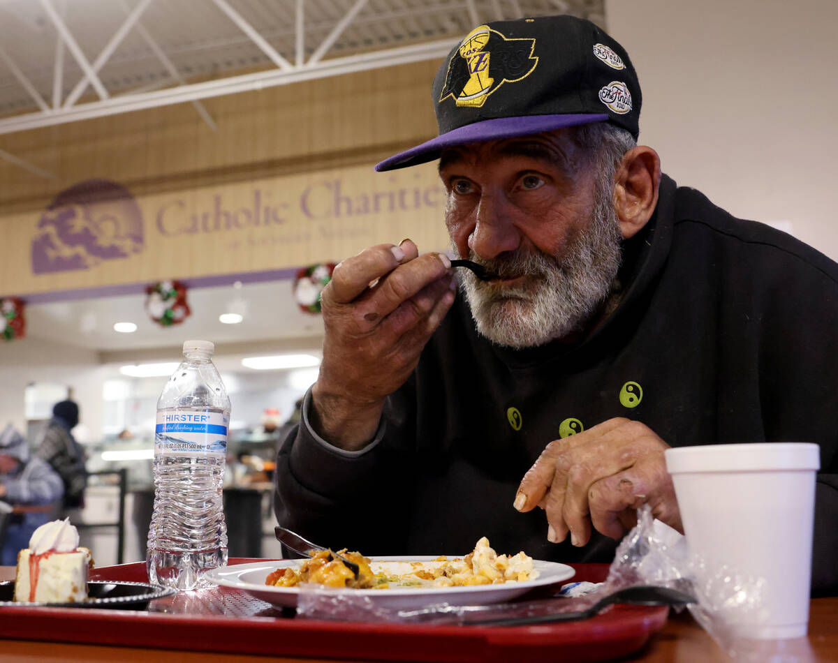 Harvey Barocas, 72, eats a Christmas meal at Catholic Charities of Southern Nevada in Las Vegas ...