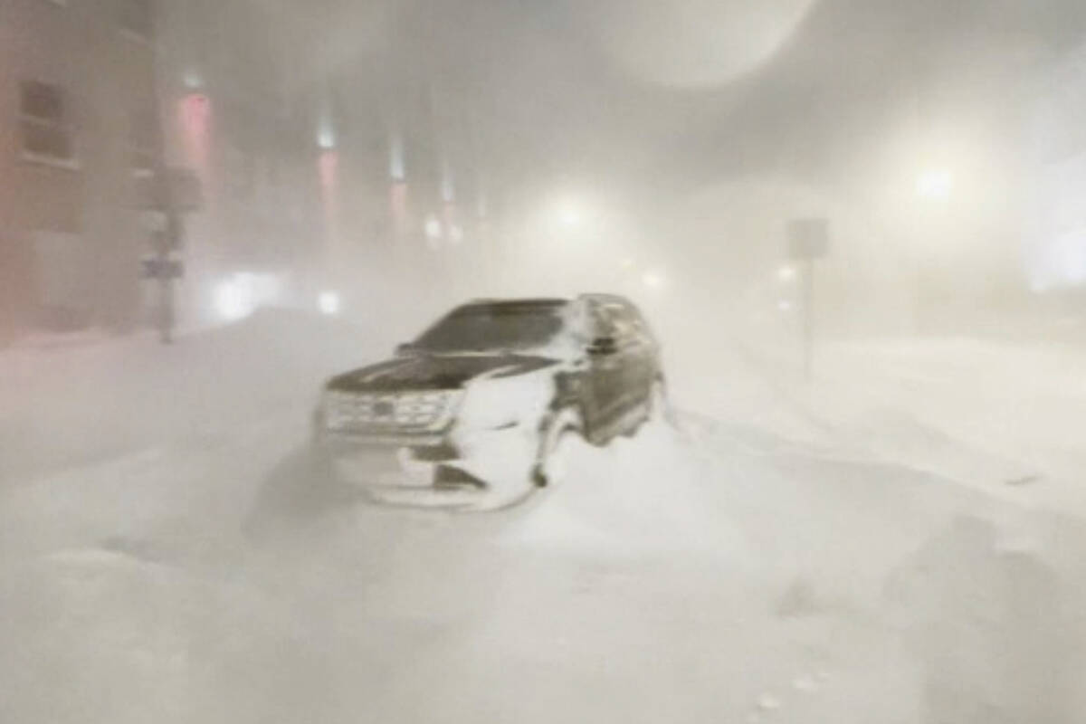 High winds and snow covers the streets and vehicles in Buffalo, N.Y. early Sunday, Dec. 25, 202 ...