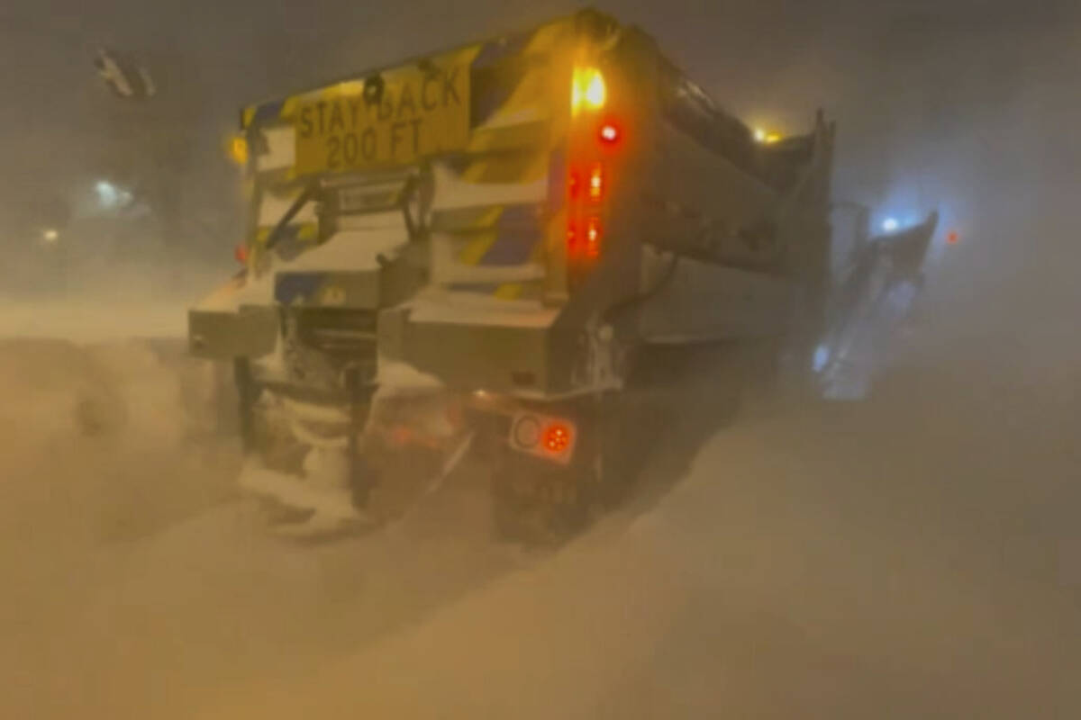High winds and snow covers the streets and vehicles in Buffalo, N.Y. early Sunday, Dec. 25, 202 ...