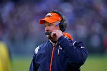 Denver Broncos head coach Nathaniel Hackett directs his team from the sideline, in the second h ...