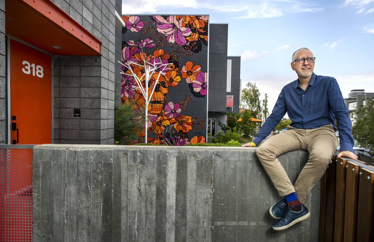 In this file image, Windom Kimsey of TSK Architects takes a moment in front of his row house at ...