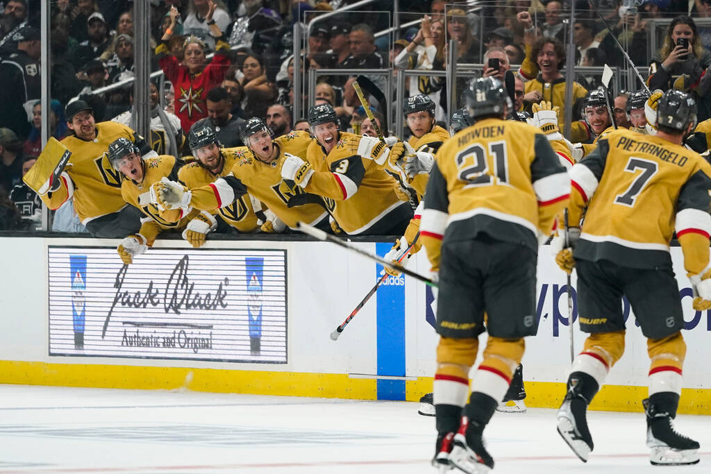 Vegas Golden Knights celebrate a goal by Mark Stone during the third period of an NHL hockey ga ...