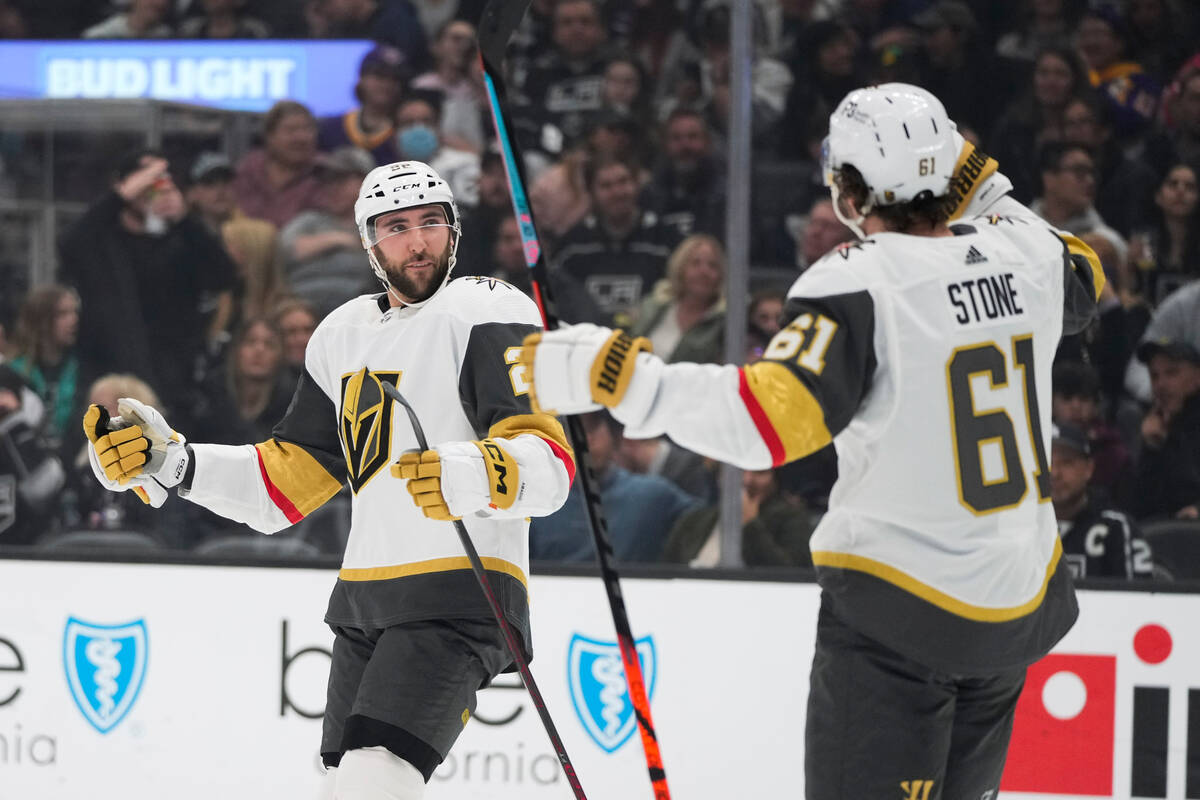 Vegas Golden Knights' Michael Amadio, left, celebrates his goal with Mark Stone during the firs ...