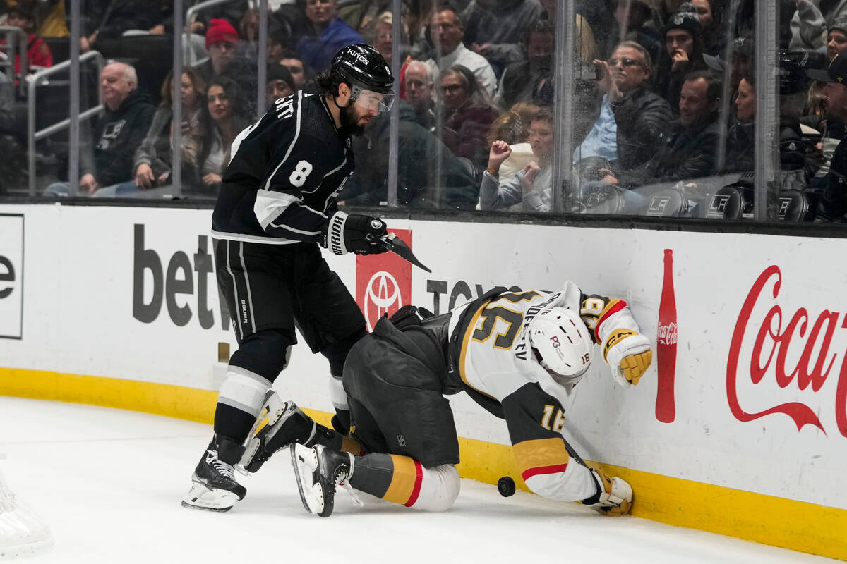 Vegas Golden Knights' Pavel Dorofeyev (16) is shoved by Los Angeles Kings' Drew Doughty (8) dur ...
