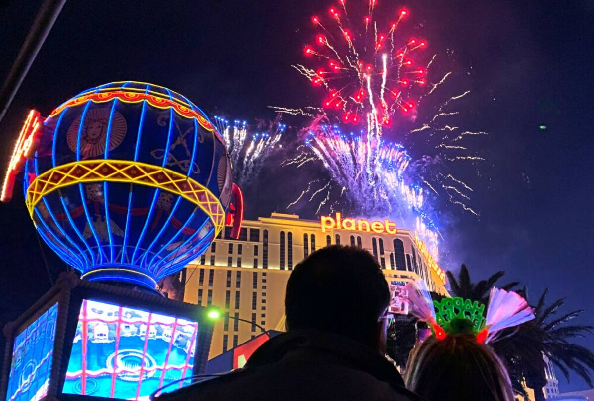 Fireworks explode over the Las Vegas Strip during New Year's celebrations, Friday, Dec. 31, 202 ...