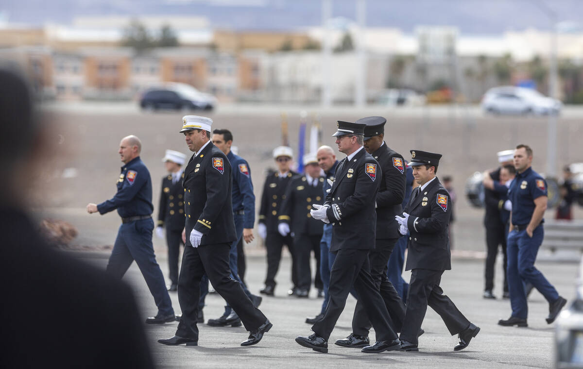 Rescue personnel arrive as Henderson Fire Department Engineer Clete Najeeb Dadian is honored in ...