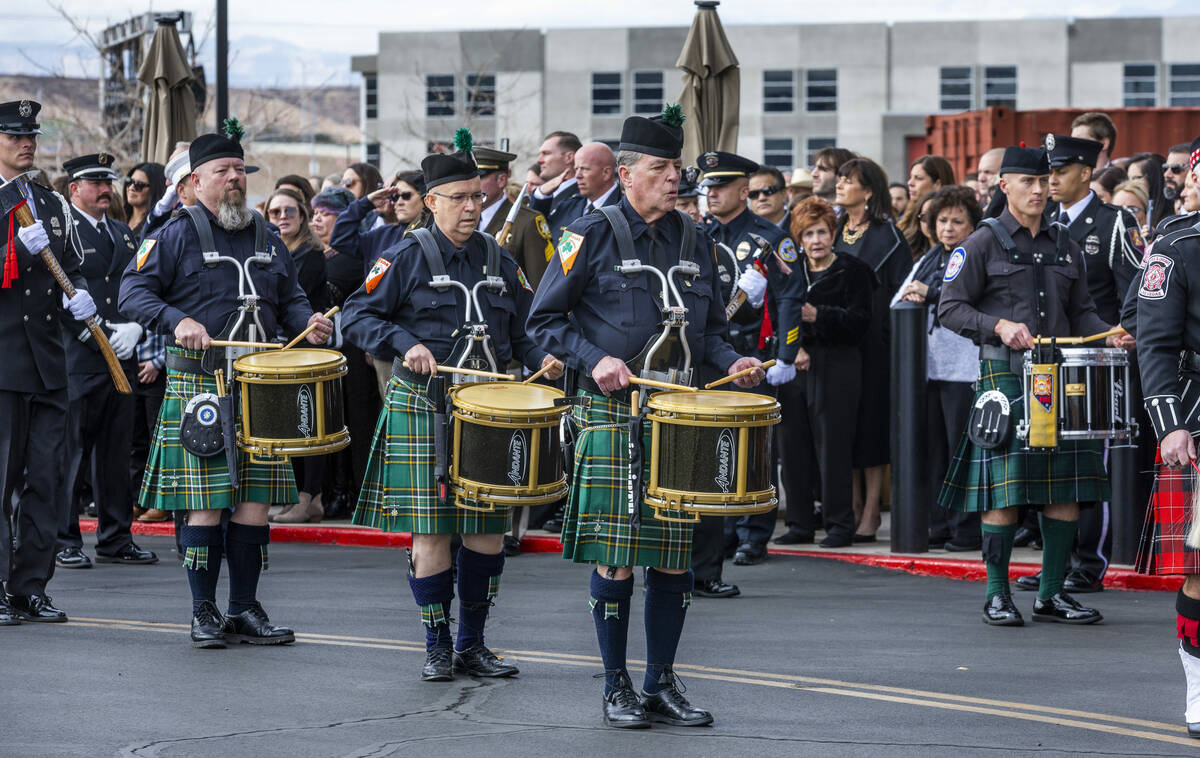 Members of the Las Vegas Emerald Society march and play in the processional as Henderson Fire D ...