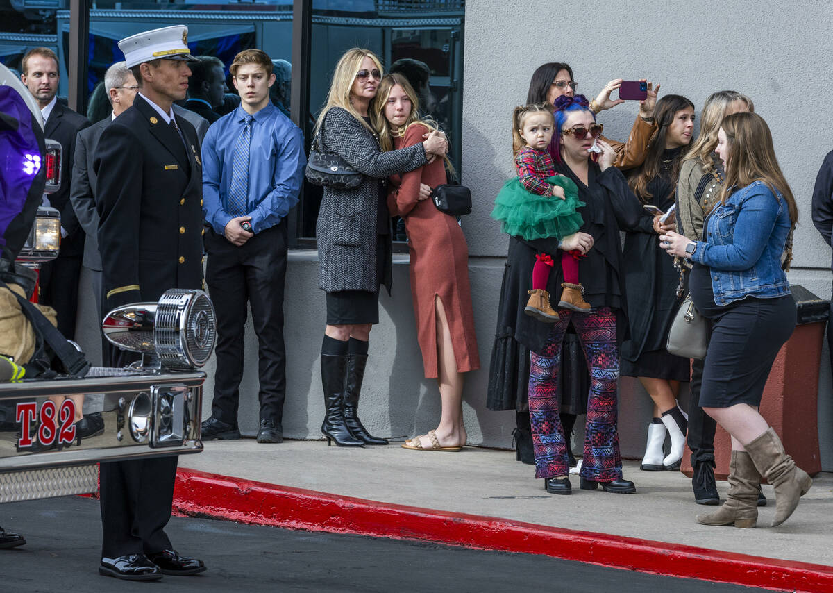 Mourners watch the processional as Henderson Fire Department Engineer Clete Najeeb Dadian is ho ...
