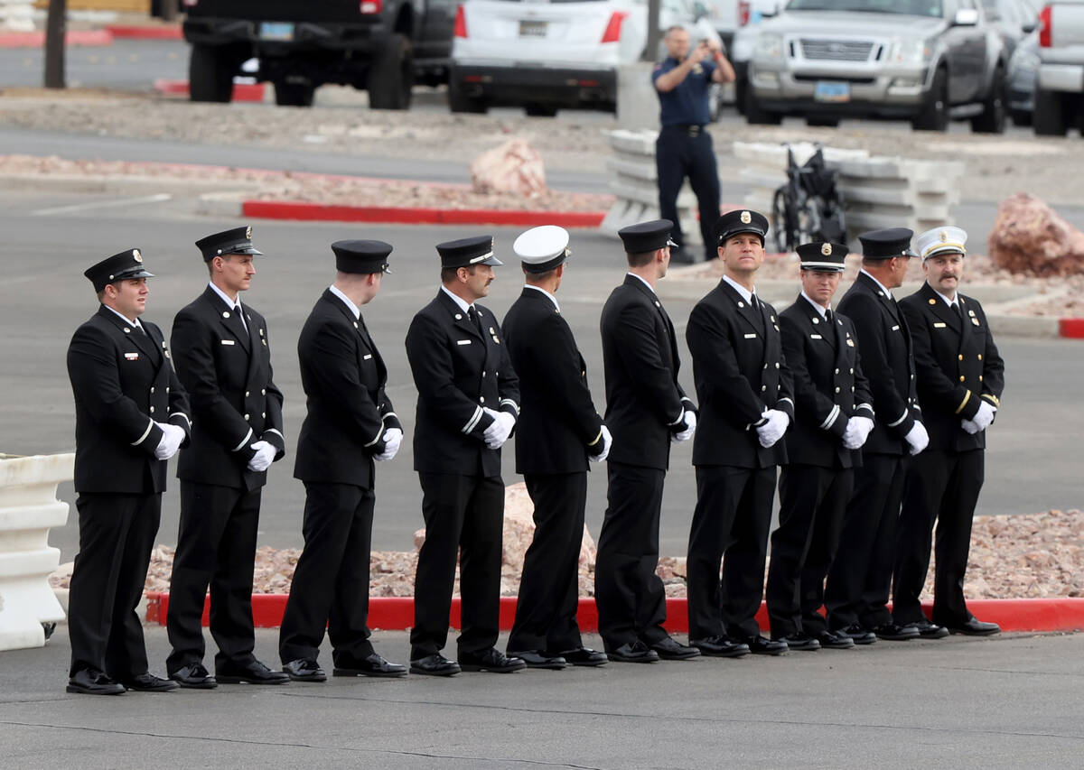 Fire personnel wait for a memorial procession for Henderson Fire Department Engineer Clete Naje ...