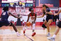 Pepperdine's Theresa Grace Mbanefo (0) and Jane Nwaba (10) defend against UNLV's Desi-Rae Young ...