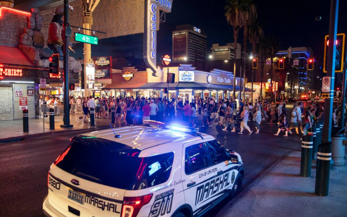 Deputies with the Las Vegas Marshals Office park outside the Fremont Street Experience on Satur ...