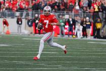 Ohio State quarterback C.J. Stroud plays against Michigan during an NCAA college football game ...