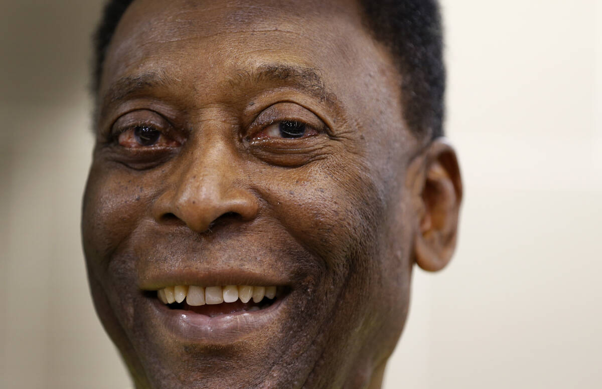 Brazilian soccer legend Pele smiles during a media opportunity at a restaurant in London, March ...