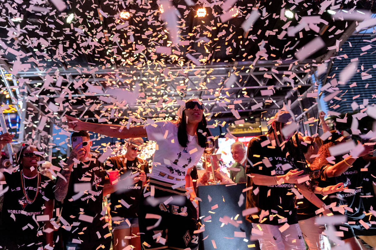Confetti rains down on the 2022 WNBA Champions, the Las Vegas Aces, during a parade to honor th ...
