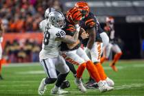 Raiders defensive end Maxx Crosby (98) sacks Cincinnati Bengals quarterback Joe Burrow (9) duri ...