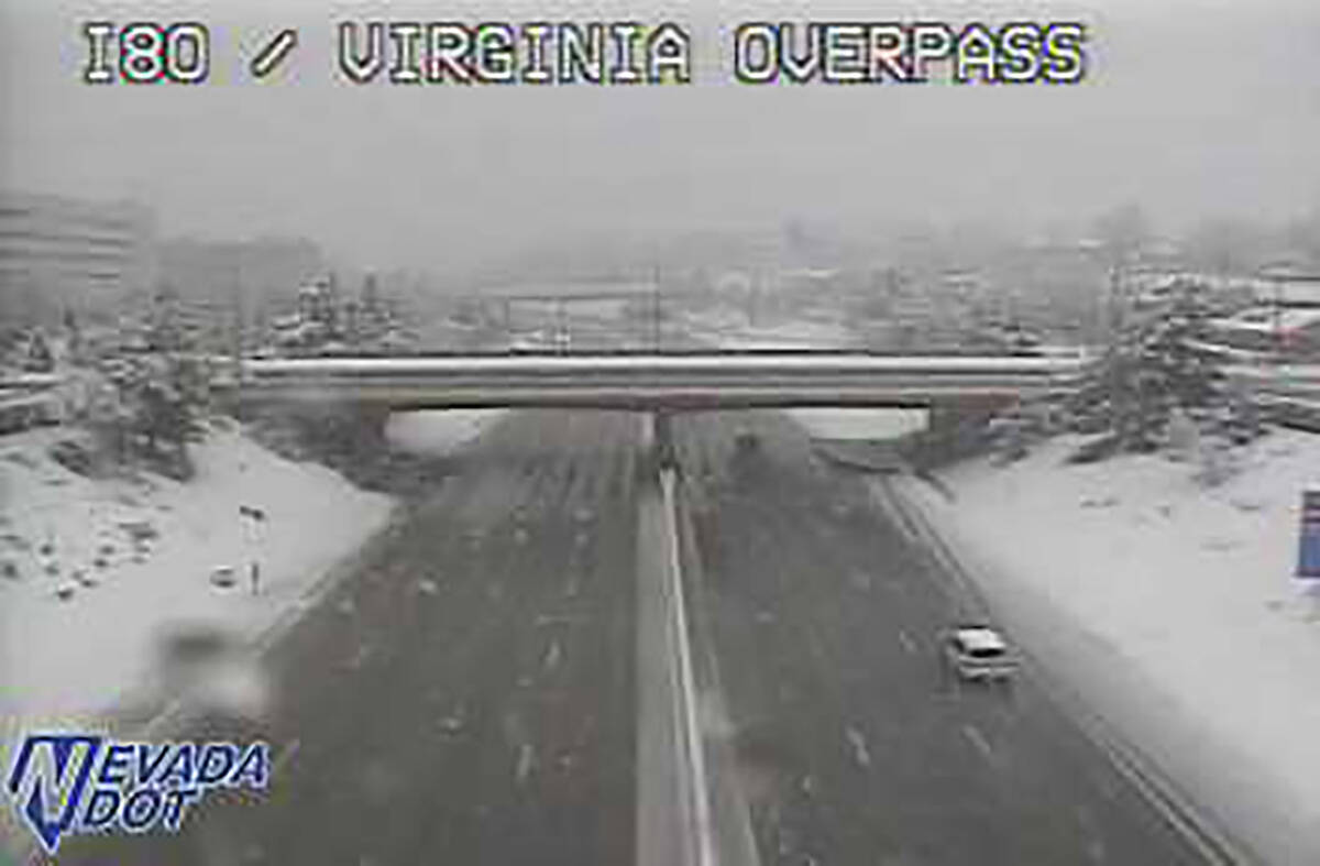 Snow covers the Interstate 80 Virginia Street overpass in Reno about 2:30 p.m. Dec. 31, 2022. ( ...