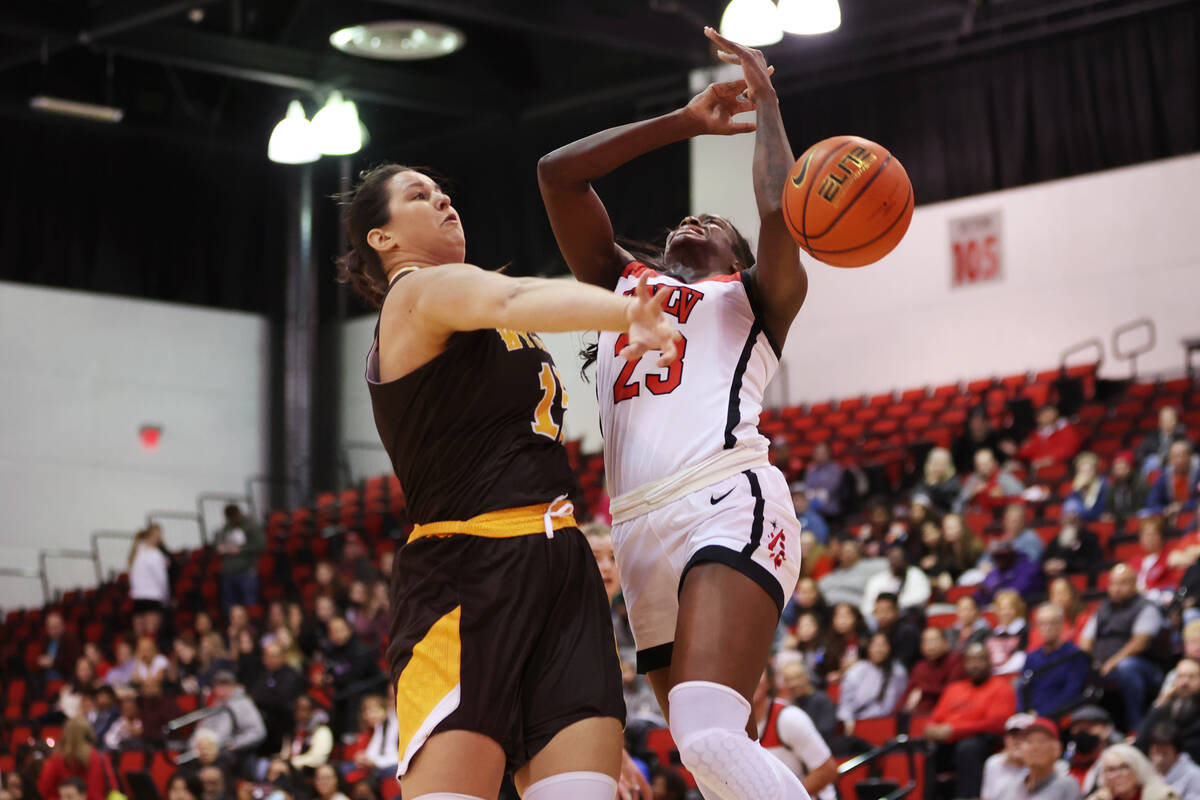 Wyoming Cowgirls forward Marta Savic (15) blocks a shot by UNLV Lady Rebels center Desi-Rae You ...